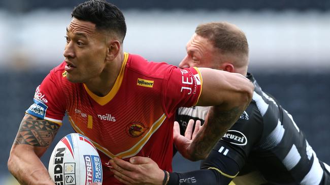 HULL, ENGLAND - MARCH 01: Israel Folau of Catalan Dragons breaks past Jake Connor of Hull FC during the Betfred Super League match between Hull FC and Catalan Dragons at KCOM Stadium on March 01, 2020 in Hull, England. (Photo by Nigel Roddis/Getty Images)