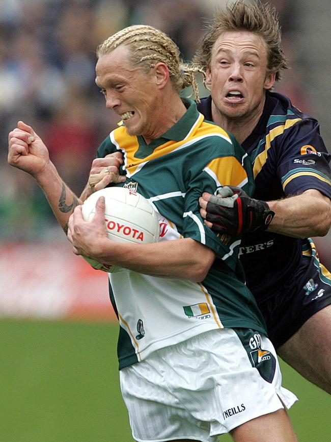 Former Saint Max Hudghton tries to collar Ireland’s Ciaran McDonald at Croke Park. Pic: AP