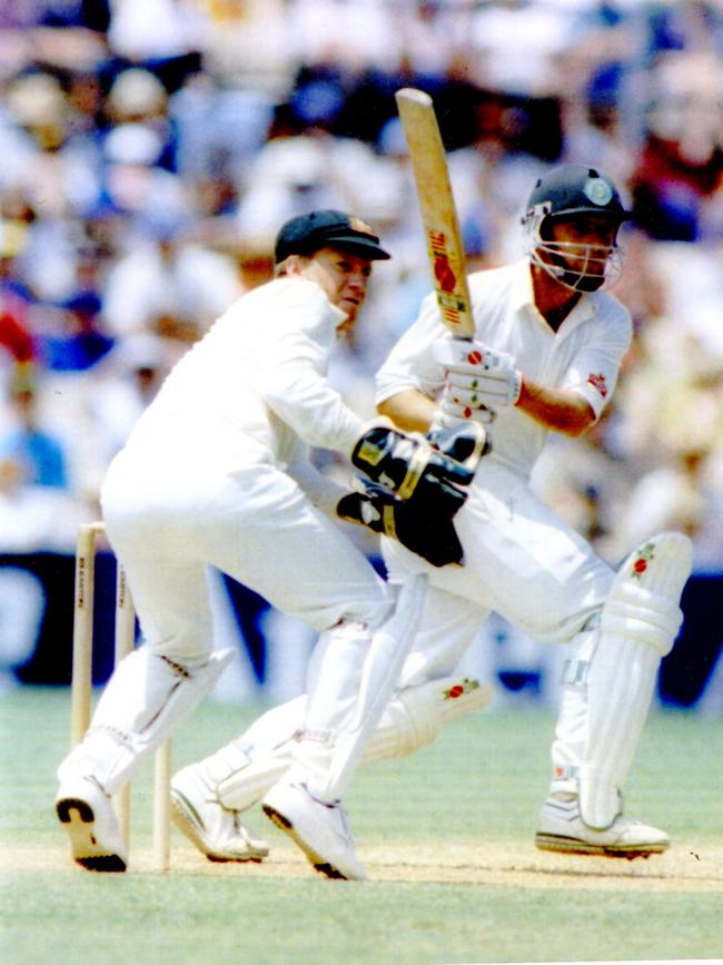 Ian Healy (l) wearing the famous cap.