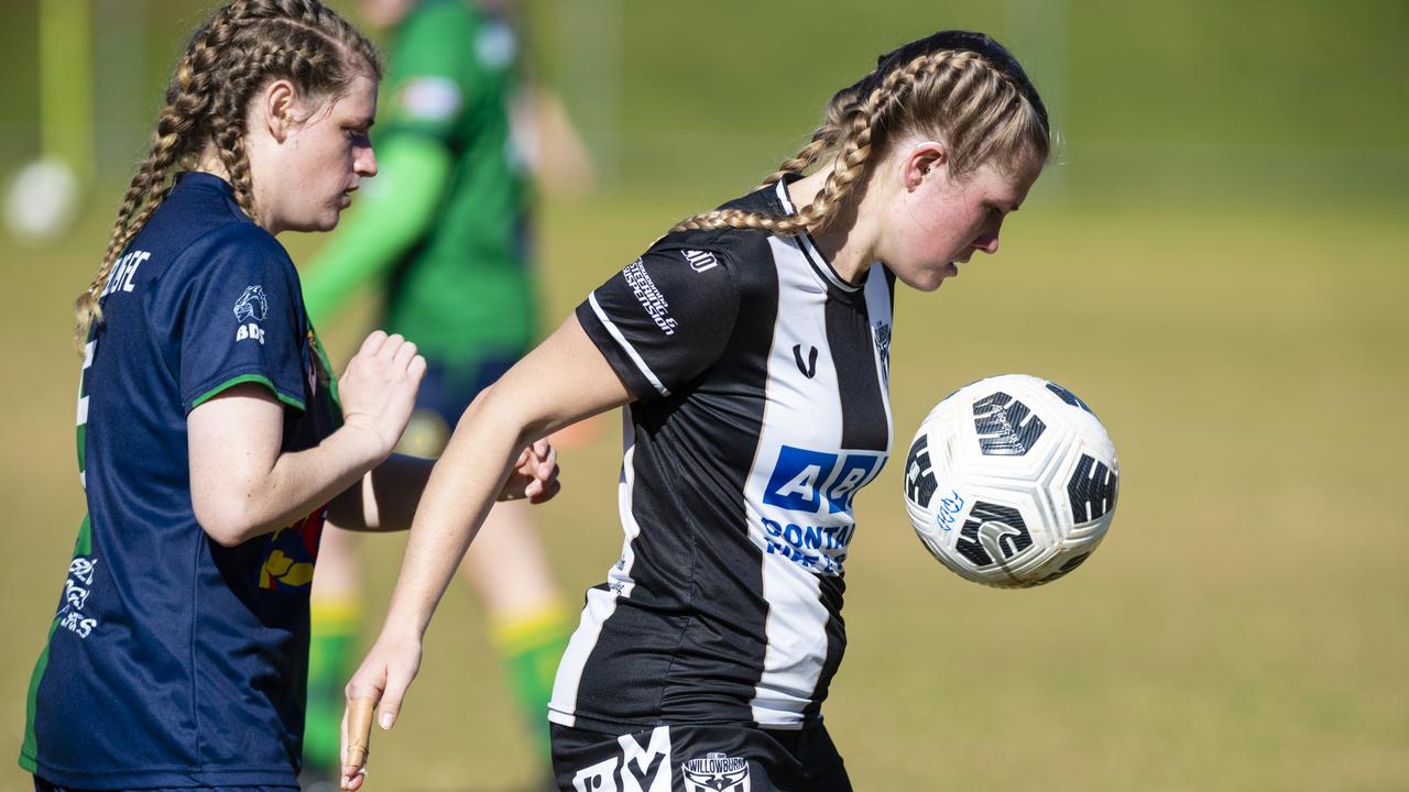 Rachael Copas (left) of Highfields and Courtney Morris of Willowburn in FQPL Women Darling Downs Presidents Cup football at West Wanderers, Sunday, July 24, 2022. Picture: Kevin Farmer