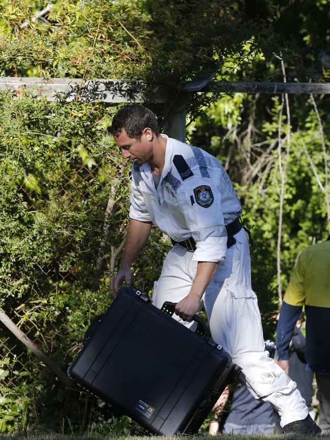 Police at the suspected murder scene. Picture: David Swift.