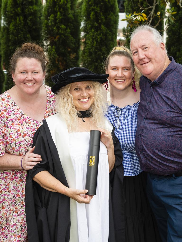 Doctor of Creative Arts graduate Terri Hethorn with family (from left) Sierra Herbert, Rhylea Millar and Joe Millar at the UniSQ graduation ceremony at Empire Theatres, Tuesday, December 13, 2022.