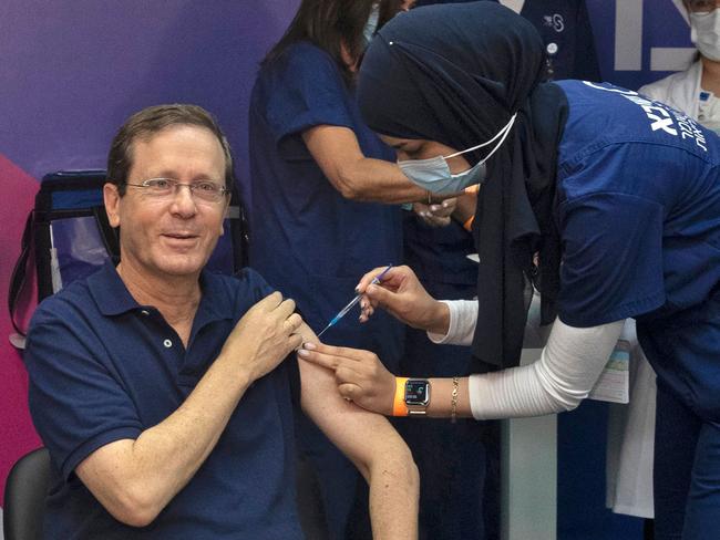 Israeli President Isaac Herzog receives a third dose of the Pfizer vaccine, launching the Jewish state's campaign to give booster shots to people aged over 60. Picture: AFP