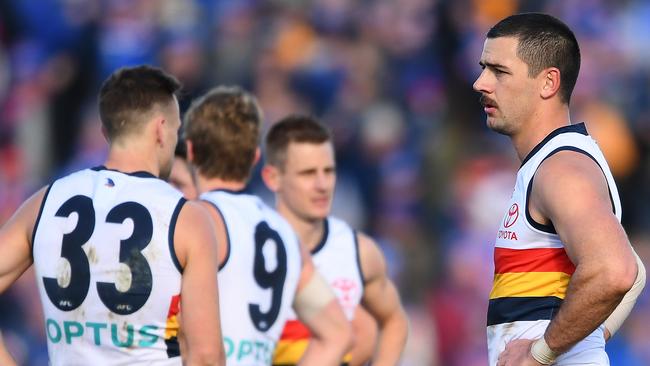 Co-captain Taylor Walker and his Crows team mates look dejected after the loss in Ballarat on Sunday. Picture: Quinn Rooney/Getty Images