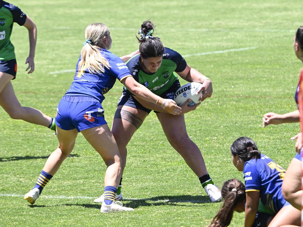 Jaida Faleono is tackled by Aaliyah Soufan. Picture: Martin Ollman