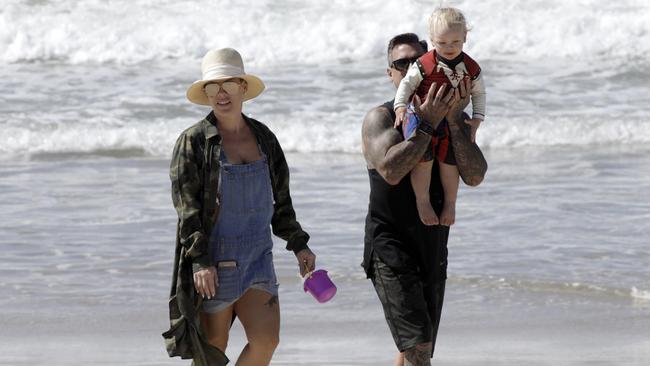 Pink on the beach with Carey Hart and son Jameson. Picture: Matrix