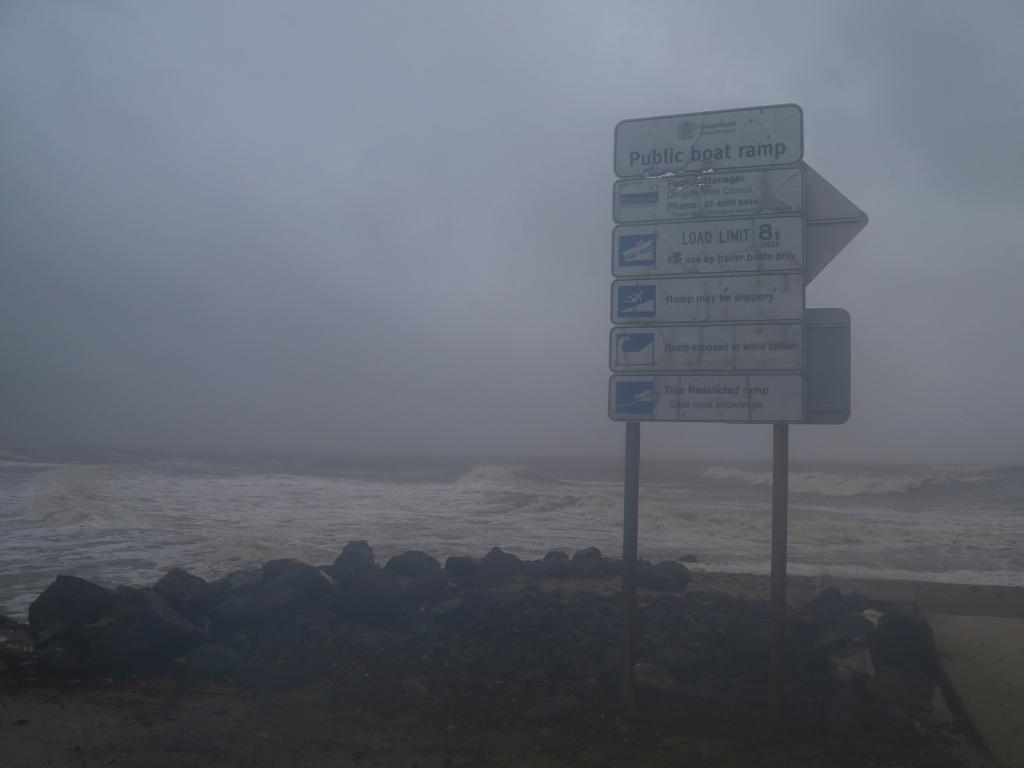 Waves crash across the rocks at the Dayman Point boat ramp. Picture: Peter Carruthers