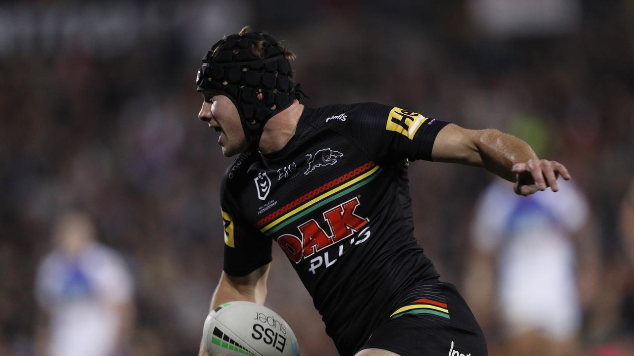 SYDNEY, AUSTRALIA - APRIL 22: Matt Burton of the Panthers scores a try during the round seven NRL match between the Penrith Panthers and the Newcastle Knights at BlueBet Stadium, on April 22, 2021 in Sydney, Australia. (Photo by Jason McCawley/Getty Images)