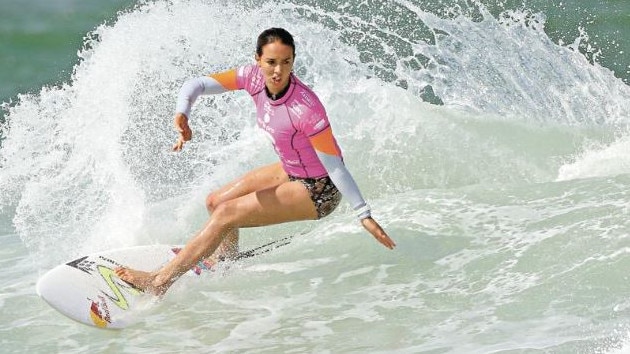 Sally Fitzgibbons is passing on what she has learnt as a successful surfer to young fans. Picture: Getty