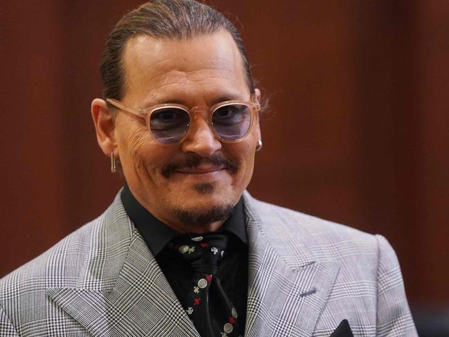 US actor Johhny Depp returns from a break during the 50 million US dollar Depp vs Heard defamation trial at the Fairfax County Circuit Court in Fairfax, Virginia, on May 19, 2022. - Actor Johnny Depp is suing ex-wife Amber Heard for libel after she wrote an op-ed piece in The Washington Post in 2018 referring to herself as a âpublic figure representing domestic abuse.â (Photo by Shawn THEW / POOL / AFP)