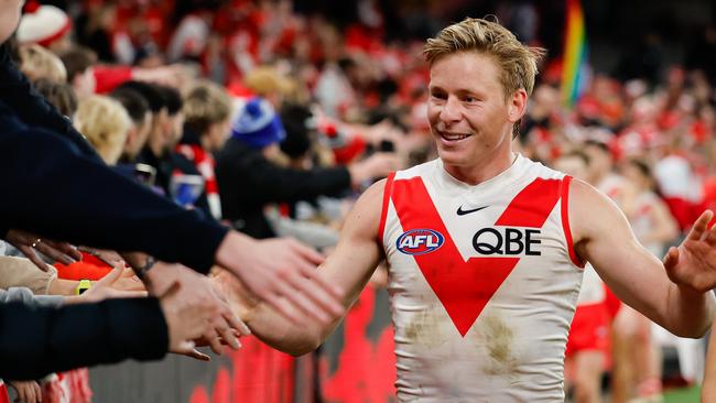 MELBOURNE, AUSTRALIA – AUG 16: Isaac Heeney of the Swans celebrates with fans during the 2024 AFL Round 23 match between Essendon Bombers and the Sydney Swans at Marvel Stadium on August 16, 2024 in Melbourne, Australia. (Photo by Dylan Burns/AFL Photos via Getty Images)