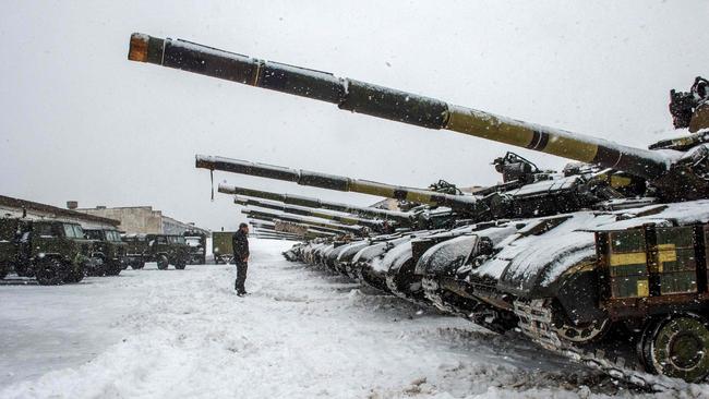 A Ukrainian Military Forces serviceman stands in front of tanks of the 92nd separate mechanised brigade near Klugino-Bashkirivka village, in the Kharkiv region. Picture: AFP