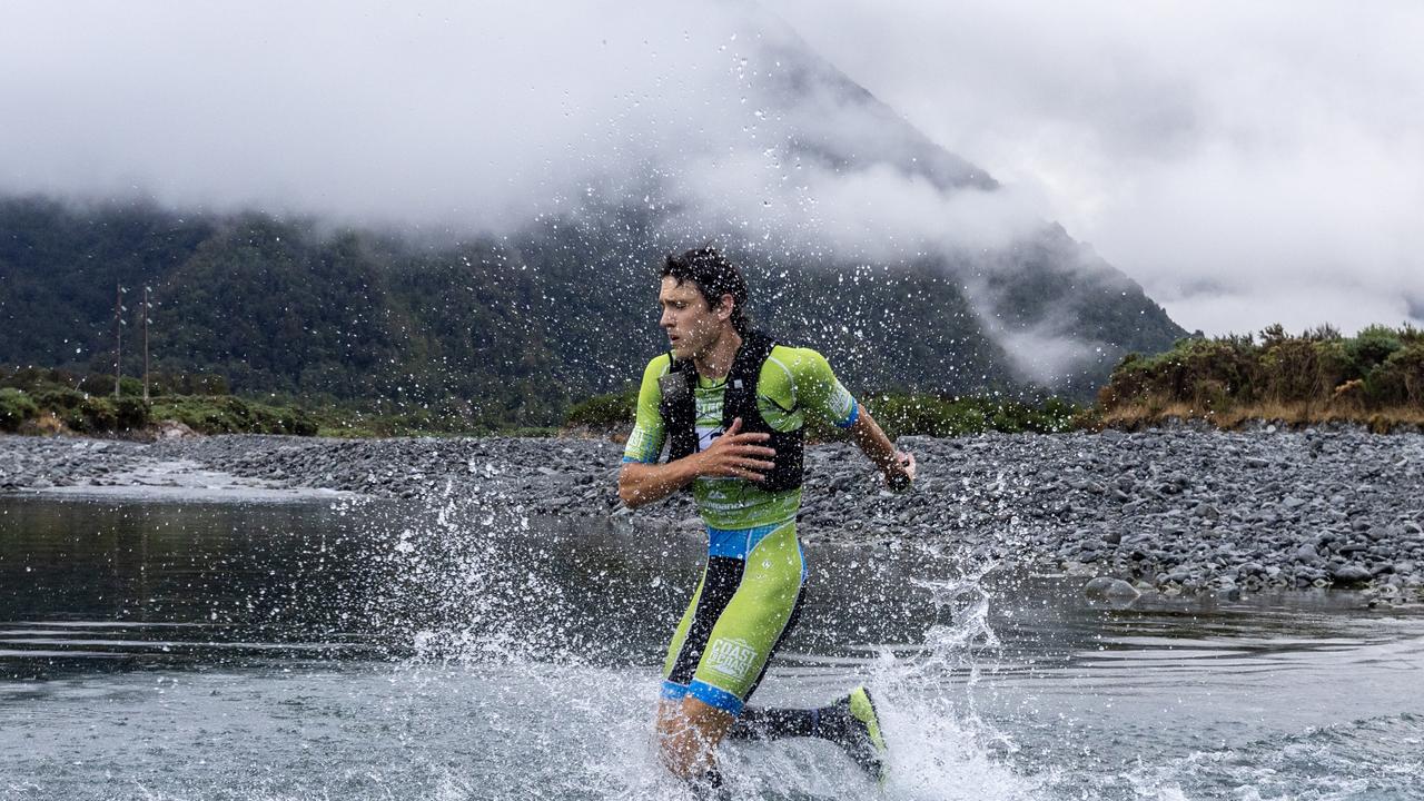 Alex Hunt at the first river crossing of the mountain run. Picture: Iain McGregor/Coast to Coast