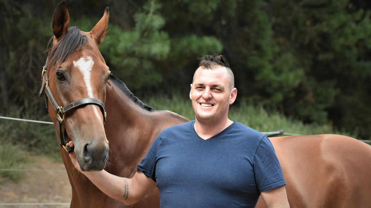 Scott Brunton with stable star The Inevitable. Picture: Peter Staples