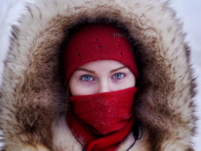 A young student poses for a portrait at a bus station in Yakutsk Village.