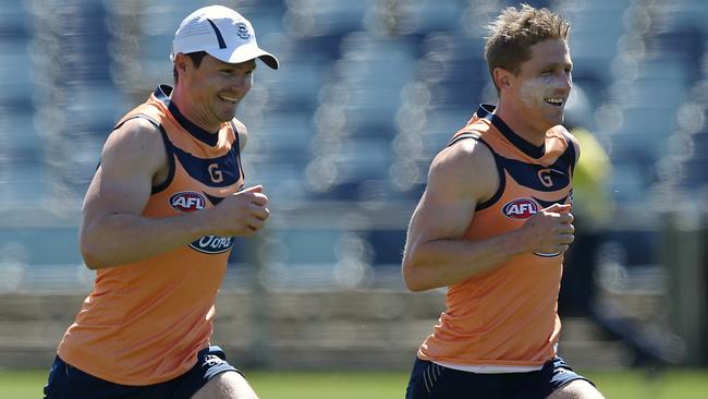 Patrick Dangerfield races Scott Selwood at Geelong training. Picture: Wayne Ludbey