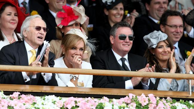 Andrew Peacock (L) and daughter Ann with Eddie and Carla McGuire, watch the 150th running of the Melbourne Cup from the grandstand at Flemington Racecourse in Melbourne. 