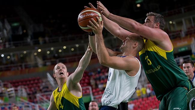 Britain's Ian Sagar, center, is blocked by Australian players Shaw Russel and Bradley Ness as the Rollers bowed out of medal contention in Rio.