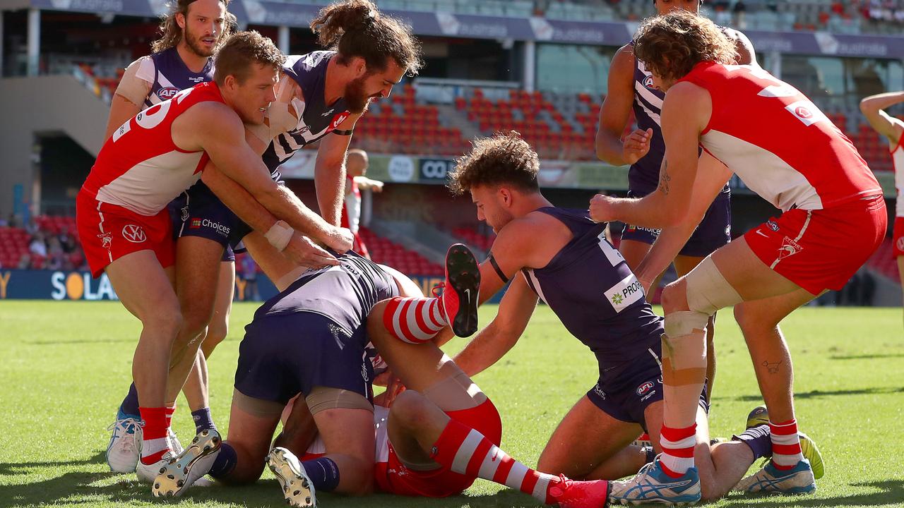 Fremantle players remonstrate with Franklin on Sunday. Picture: Kelly Defina/Getty Images