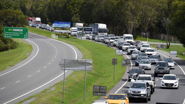 Police check cars as they cross the Queensland-NSW border in Coolangatta. Picture: Steve Holland