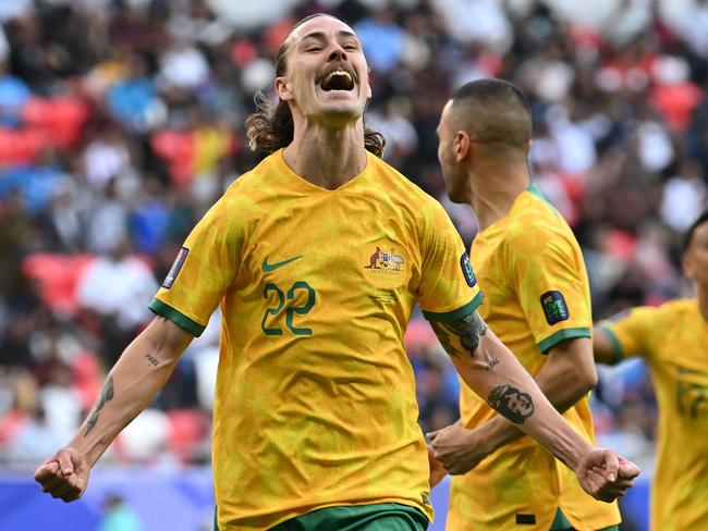 Australia's midfielder #22 Jackson Irvine celebrates after scoring his team's first goal during the Qatar 2023 AFC Asian Cup Group B football match between Australia and India at the Ahmad bin Ali Stadium in Al-Rayyan, west of Doha on January 13, 2024. (Photo by HECTOR RETAMAL / AFP)