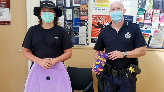 Jack Topp, 14, reunited with his late father's boogie board after it was swept out to sea at Tugun beach on Monday morning. Picture: Danielle Topp.