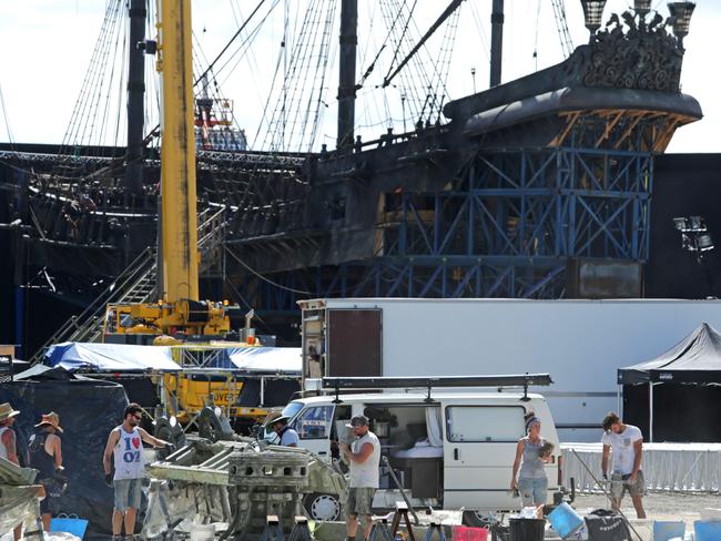 Pirates of the Caribbean on the Coast: Set builders at Helensvale return to work on creating a battered Black Pearl as filming is set to resume. Picture: Tim Marsden