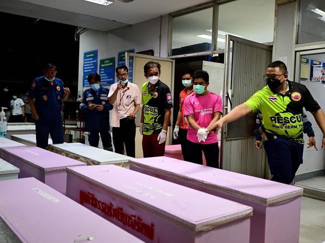 Rescue personnel count coffins carrying victim’s bodies at the hospital morgue in Udon Thani. Picture: AFP