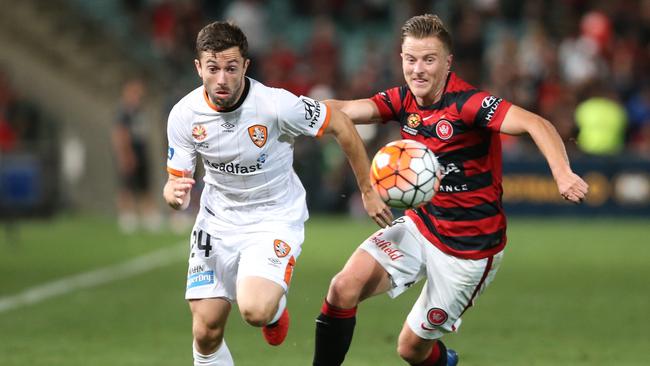 Brisbane Roar’s Thomas Broich with Wanderers Scott Jamieson in the thriller at Pirtek Stadium on Sunday.