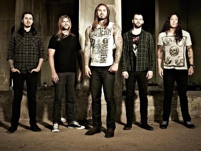 As I Lay Dying ... Lambesis, centre, with his band mates. Many Christian rockers are atheists who are faking their faith in God to sell records in the lucrative Christian market, Lambesis claims. Picture: Facebook