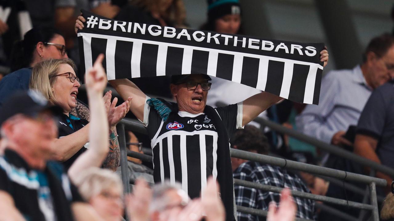 Power fans celebrate during the 2020 AFL Round 18 match between the Collingwood Magpies and the Port Adelaide Power at The Gabba. (Photo by Michael Willson/AFL Photos via Getty Images)