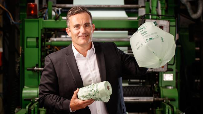 BioBag World Australia Director Scott Morton with new machinery at Netley, and the Biobags it produces. Picture: Matt Turner.