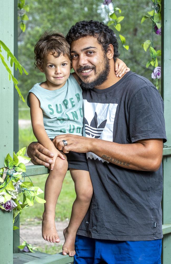 Aaron Melville with three-year-old Omari on their Jimboomba property. Picture: Richard Walker