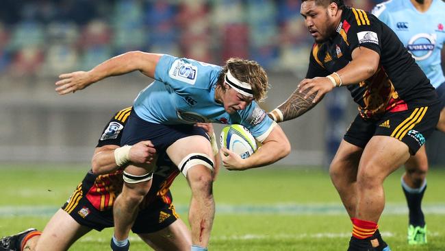 Waratahs backrower Michael Hooper runs the ball against the Chiefs.