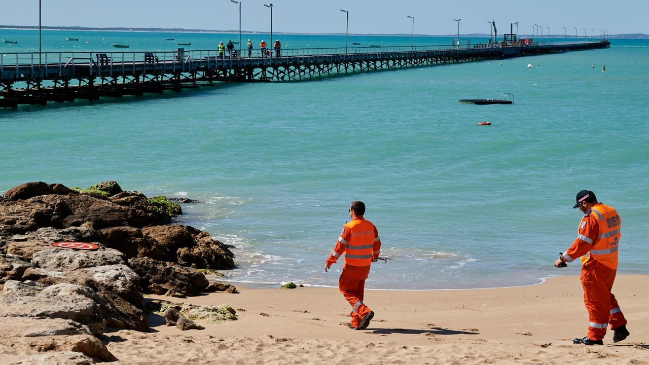 SES crew at Beachport Jetty after a shark attacked local swimmer Pamela Cook. Picture: Frank Monger