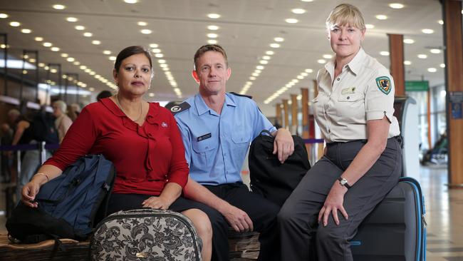 Tasmania Fire Service staffers, from left, Maree Hinton and Andrew McConnon, together with Adele Wright from Parks and Wildlife, were the first three Tasmanians to fly north to help out in the aftermath of Cyclone Debbie. Picture: SUPPLIED
