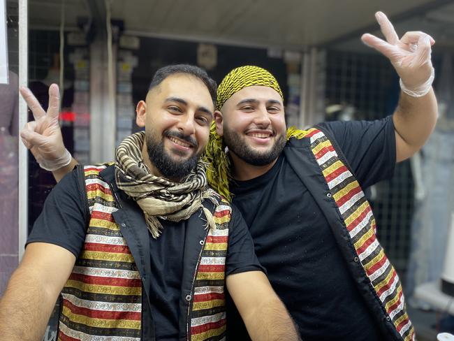 Tarak Alawad (left) and a friend working their knafeh stall at Ramadan Night Markets. Picture: Kirsten Jelinek