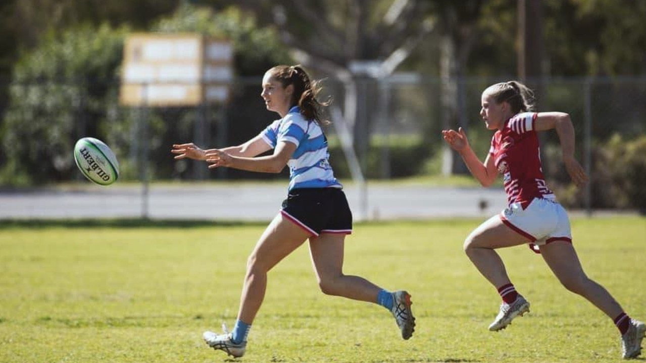 Hannah Jakins (left) fires off a pass.