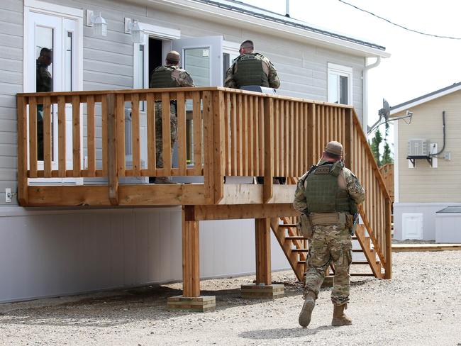 Gillam police go door to door in the search for Kam McLeod and Bryer Schmegelsky. Picture: Clint Brewer/ News Corp Australia