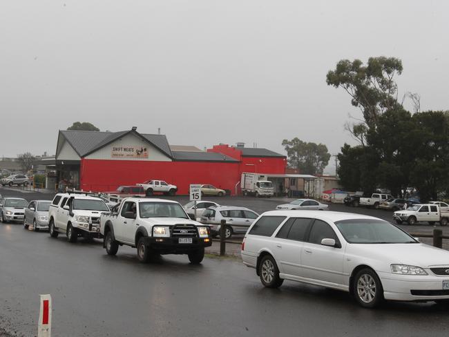 Workers evacuate Swift Meatworks in Longford. Picture: BRUCE MOUNSTER