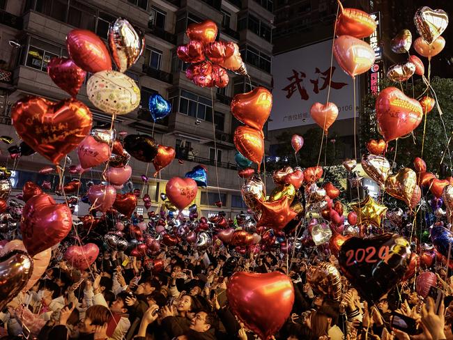 People release balloons into the air to celebrate the new year on Jianghan Road in Wuhan, China. Picture: Getty Images