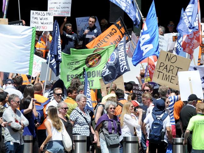 Public transport staff hold a stop-work meeting outside Flinders Street Station. Picture: Andrew Henshaw