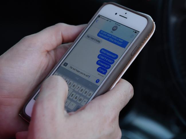 People are seen using their phone while driving in Darwin. Picture: Keri Megelus