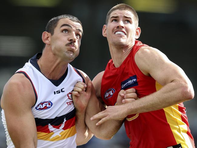 AFL - Adelaide Crows v Gold Coast at Noarlunga Oval.T Taylor Walker contests the boundary throw in with Zac Smith SARAH REED