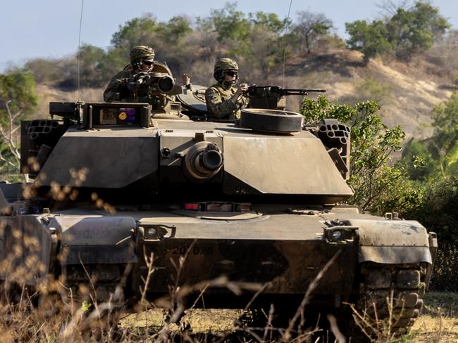 Australian Army soldiers from the 1st Armoured Regiment conduct manoeuvre training on an M1A1 Abrams Main Battle Tank in Puslatpur, Indonesia during Exercise Super Garuda Shield 2023. *** Local Caption *** At the invitation of Indonesian Armed Forces (TNI), Australia is contributing over 125 personnel from the Australian Defence Force (ADF) to Exercise Super Garuda Shield 2023 (SGS23). SGS23 is an TNI and United States Indo Pacific Command led bilateral training activity. It is focused on joint operations with international partners in and around East Java in Indonesia from 31 August to 13 September. Held since 2009, the ADF first participated in 2022, and in 2023 is contributing an Australian Army force element including a Troop of M1A1 Abrams tanks from the 1st Armoured Regiment.  The contingent also includes an Infantry Platoon from the 10th/27th Battalion, Royal South Australian Regiment, command and control elements, and a range of armoured vehicles, trucks and recovery vehicles.