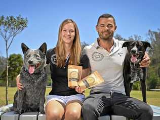 DOGGY SNACKS: Katharina von Heusinger and partner Reiner Adolfsen who have started a healthy dog treat bakery out of Borallon Correctional Facility, seen here with with dogs Winston and Jett. Picture: Cordell Richardson