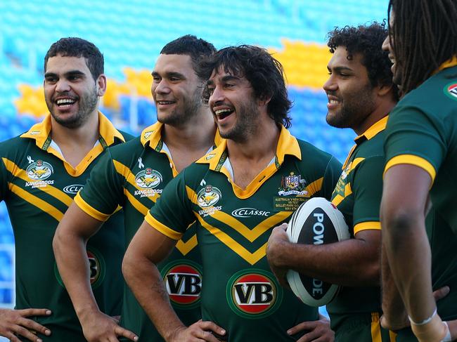 Yow Yeh (second from left) flanked by Kangaroos’ teammates Greg Inglis, Jonathan Thurston, Sam Thaiday and Jamal Idris in May, 2011. Picture: Chris Hyde