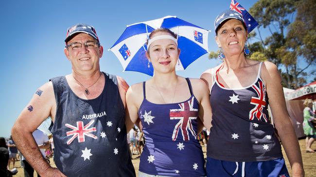 Australia has been named the world’s happiest developed nation. Proud Aussies Sam, Melissa and Karina Adams are pictured at Geelong City Australia Day celebrations. Picture: Nathan Dyer