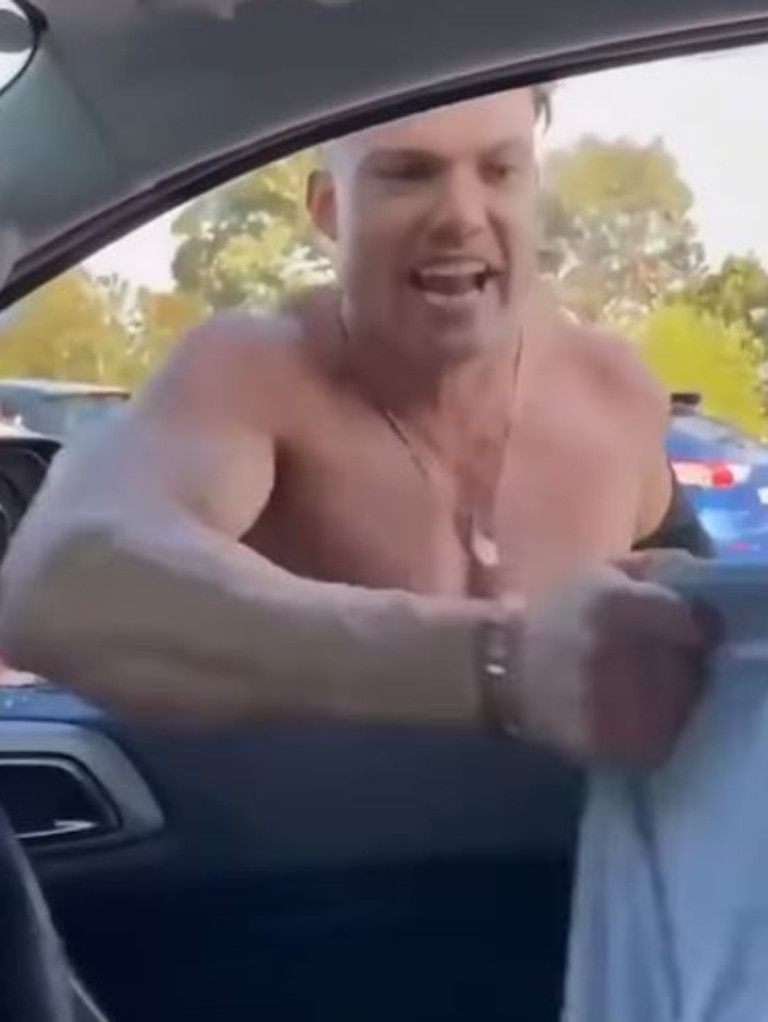 Footage emerged of a shirtless man smashing a car window and yelling about vaccines last week. Picture: 9NEWS