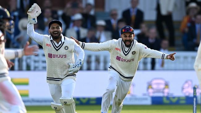 Virat Kohli and Rishabh Pant celebrate a wicket.